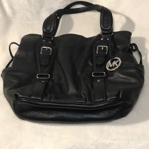 Michael Kori’s black leather tote